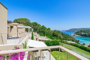 a view of the ocean from the balcony of a house at Baia di Spartaia 1 in Procchio
