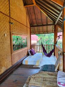 Postel nebo postele na pokoji v ubytování Tangga Bungalows Gili Air