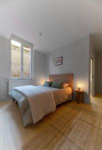 Postel nebo postele na pokoji v ubytování Résidence Desroziers - Appartements design en centre ville
