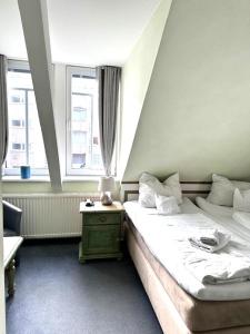 Postel nebo postele na pokoji v ubytování Hotel Villa Weststrand