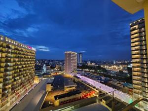 a view of a city at night with buildings at Apartemen Nagoya Thamrin Tower B lvl 12 Free Netflix in Nagoya