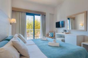 Postel nebo postele na pokoji v ubytování Hotel Miramar
