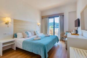 Postel nebo postele na pokoji v ubytování Hotel Miramar