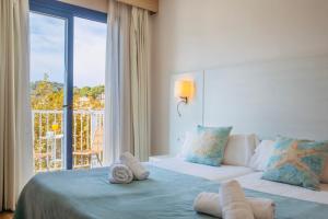 Postel nebo postele na pokoji v ubytování Hotel Miramar