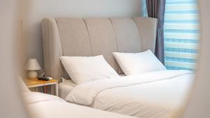 Ένα ή περισσότερα κρεβάτια σε δωμάτιο στο Donghae badae meomuleuda