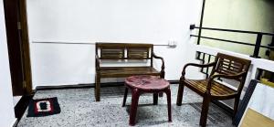 two chairs and a table on a balcony at Zainy Holiday Apartment in Galle +14 photos