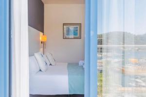 Postel nebo postele na pokoji v ubytování Hotel Miramar