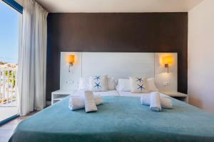 Postel nebo postele na pokoji v ubytování Hotel Miramar