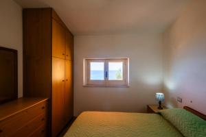 Postel nebo postele na pokoji v ubytování Casa fiorina a Capo vaticano