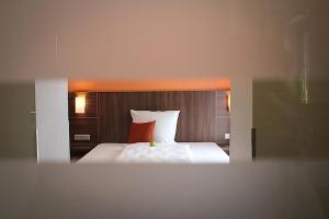 Postel nebo postele na pokoji v ubytování Hotel Rosenhof Garni
