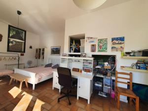 a bedroom with a desk and a bed and a desk at Tranquilidad cerca de Barcelona in Molins de Rei +13 photos
