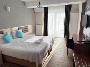 Postel nebo postele na pokoji v ubytování Figen Suite Hotel 2