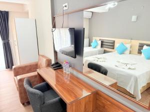 Postel nebo postele na pokoji v ubytování Figen Suite Hotel 2
