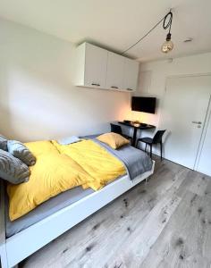 Ένα ή περισσότερα κρεβάτια σε δωμάτιο στο Greenroom Apartment