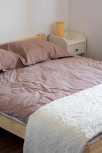 Ένα ή περισσότερα κρεβάτια σε δωμάτιο στο Apartament Kama