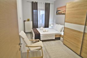 เตียงในห้องที่ Afroditi