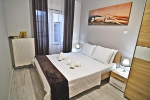 เตียงในห้องที่ Afroditi +14 ภาพ