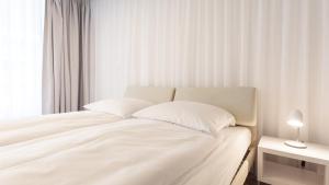 Posteľ alebo postele v izbe v ubytovaní VacationClub - Ultra Marine Apartament 53 + 20 fotografií