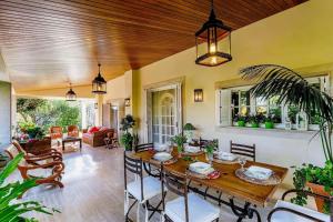a dining room with a wooden table and chairs at C221 CAN MANDOL ETV6207 by Mallorca Villa Selection in Inca