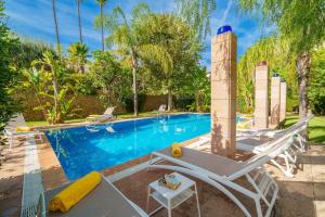 a swimming pool with a chaise lounge and a swimming pool at C221 CAN MANDOL ETV6207 by Mallorca Villa Selection in Inca