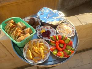 a tray filled with different types of food on a table at Hashem Nubian Guest House in Aswan +12 photos