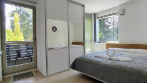 Postel nebo postele na pokoji v ubytování Tiché Anenské Apartmány s hotelovým servisem a s kvalitní snídaní na apartmán - by Relax Harrachov