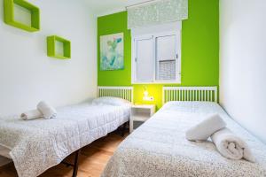 A bed or beds in a room at Apartamento Caracola