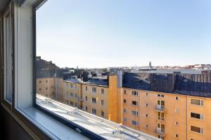 a view of a city from a window at Forenom Serviced Apartments Helsinki Kruununhaka in Helsinki