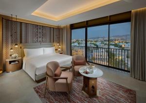 Postel nebo postele na pokoji v ubytování Mandarin Oriental, Muscat