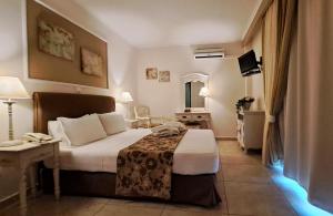 Postel nebo postele na pokoji v ubytování Hotel Astron Princess