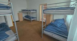 Rúm í herbergi á IN hostel Prague