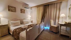 Postel nebo postele na pokoji v ubytování Hotel Astron Princess