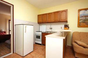 Kuchyňa alebo kuchynka v ubytovaní Apartments Ivans
