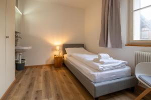 Postel nebo postele na pokoji v ubytování Hotel Restaurant Simplon