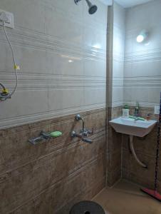 a bathroom with a sink and a shower at Seadeck Homestay in Harnai +110 photos