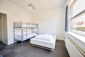 Ένα ή περισσότερα κρεβάτια σε δωμάτιο στο Roskilde Danhostel