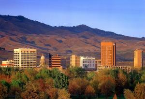 a city with buildings and mountains in the background at Country Inn & Suites by Radisson, Boise West - Meridian in Meridian