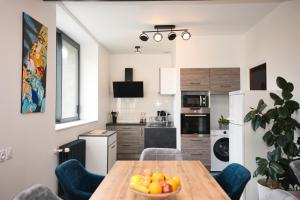 Kuchyň nebo kuchyňský kout v ubytování Votre appartement à Chalmazel