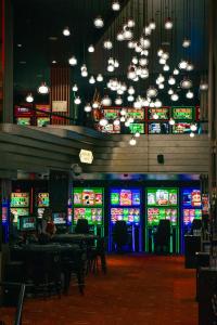 a casino with lots of slot machines at Radisson Blu Iveria Hotel in Tbilisi City