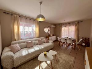 a living room with a couch and a table at Doral Paradise Gran Canaria in Maspalomas