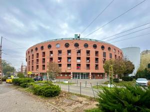 a large red brick building on a city street at FREE PARKING - Stargate Budapest in Budapest