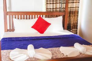Postel nebo postele na pokoji v ubytování Harmony Beach Resort