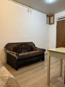 a dog bed sitting on the floor in a room at Hostel EURO in Baku +12 photos