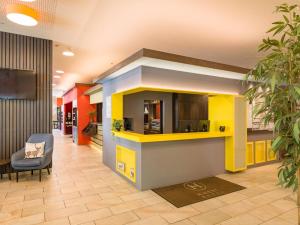 TV a/nebo společenská místnost v ubytování Hwest Hotel