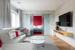 TV a/nebo společenská místnost v ubytování ProfilHotels President