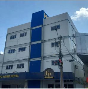 a blue and white building with a sign on it at Executivo Prime Hotel in Teresina