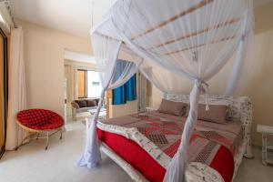 Letto o letti in una camera di The Afters Boutique Hotel Diani