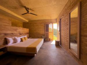 a bedroom with a large bed in a room at Torrearena Design Hotel in Puerto Escondido