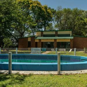 a large swimming pool in front of a building at El Descanso in Villa Lía +22 photos