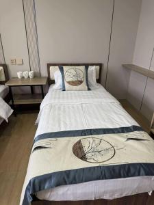 a bedroom with a bed with a blanket on it at Erkhes hotel in Dalandzadgad